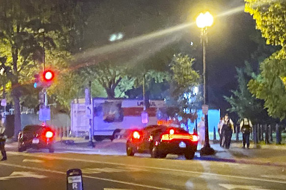 A box truck is seen crashed into a security barrier at a park across from the White House on Monday night local time. 