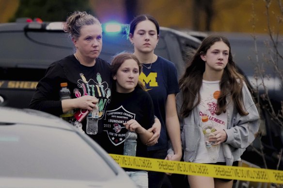 A family leaves the shelter after multiple injuries were reported.