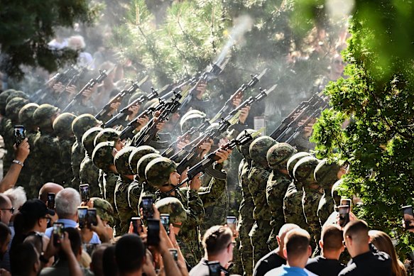 A three-volley salute is fired.