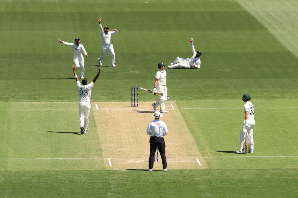 Steve Smith walks after glancing Jasprit Bumrah down the leg side.