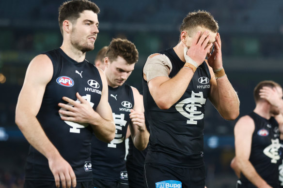 Patrick Cripps leads the Blues off the field after the loss to the Bulldogs.