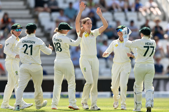 Annabel Sutherland celebrates with teammates after dismissing England’s  Emma Lamb.