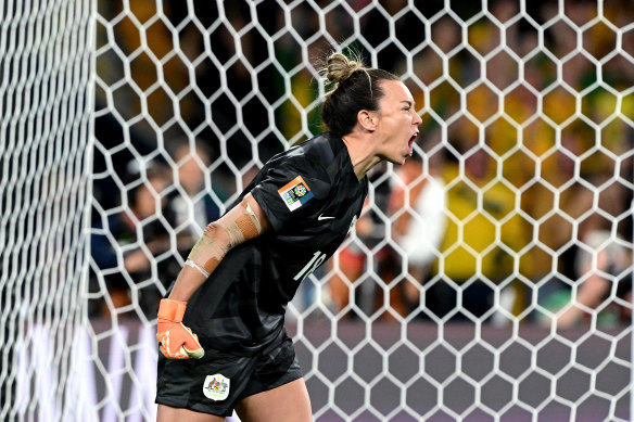 Arnold celebrating saving the first penalty from Selma Bacha of France.