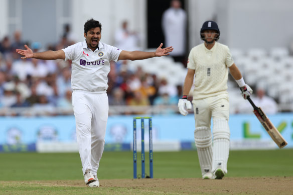 Shardul Thakur celebrates the wicket of England captain Joe Root on day one of the first Test.