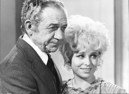 Sid James and Barbara Windsor filming 'Carry on Girl', 1975.
