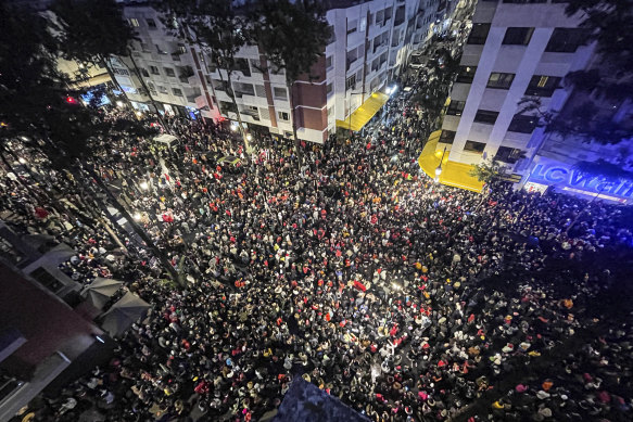 Moroccan fans celebrate the team’s victory over Canada in the capital, Rabat.