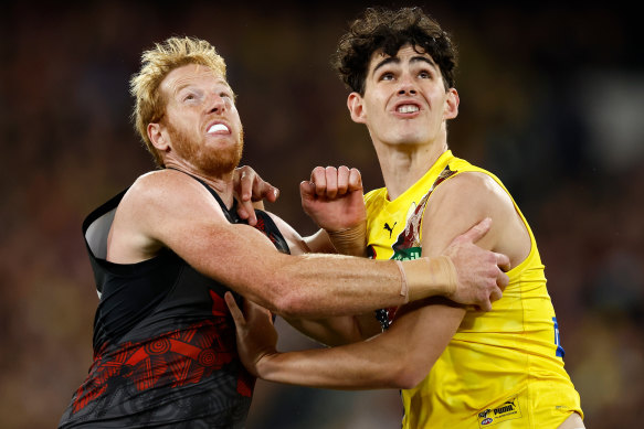 Andrew Phillips of the Bombers and Samson Ryan of the Tigers compete for the ball.