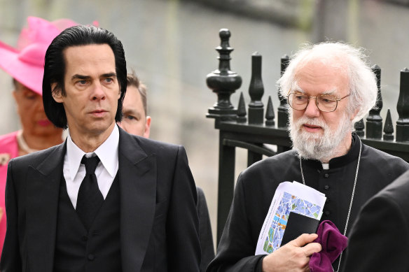 Nick Cave and Rowan Williams arrive at Westminster Abbey.