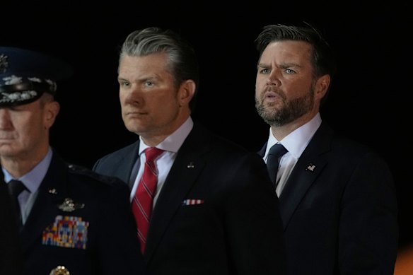 War Secretary Pete Hegseth and Vice President JD Vance watch as an Army carry team moves the transfer case containing the remains of US service members killed in the Middle East.