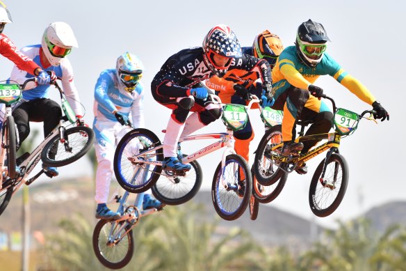 Sam Willoughby (in green and  gold) racing in the London Olympics, 2012.