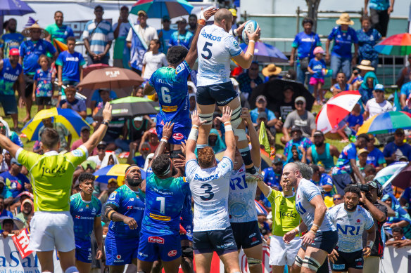 Fergus Lee Warner catches a ball at a lineout. 