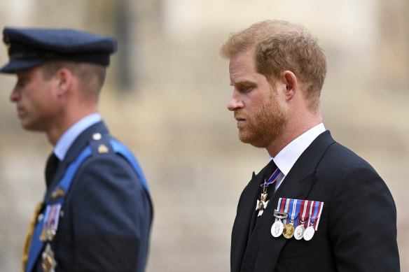 Britain’s Prince William and Prince Harry follow the State Hearse carrying the coffin of Queen Elizabeth II.