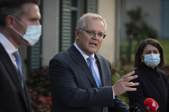 The Prime Minister, centre, with Dominic Perrottet and Gladys Berejiklian.