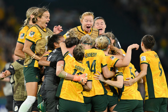 A night for the ages: The Matildas come together after the winning penalty.