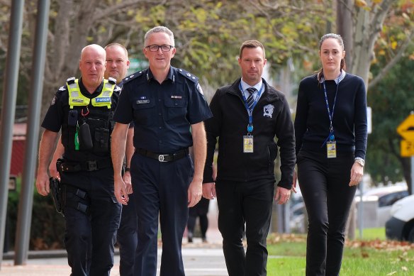 Superintendent Cowan with police from Dandenong who took part in the operation.