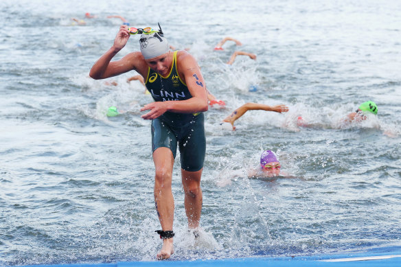 Australian triathlete Sophie Linn makes it out of the Seine without getting sick.