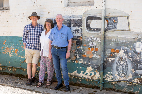 Yackandandah Community Development Company board members Ian Fitzpatrick, Ali Pockley and Ian Nightingale at the old service station. 