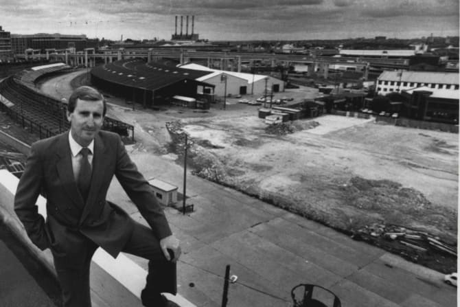 NSW minister for public works, Laurie Brereton, with Darling Harbour behind him in October 1984