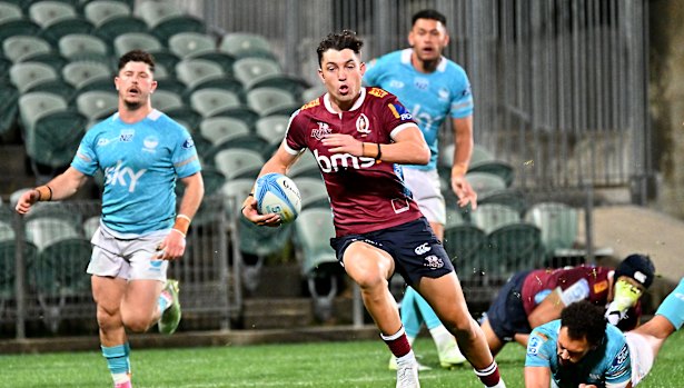 Jock Campbell of the Reds scores a try during the round 15 Super Rugby match against Moana Pasifika at North Harbour Stadium.