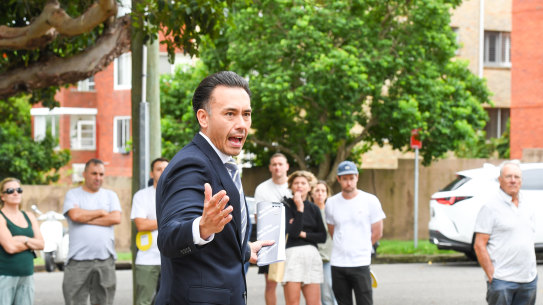 Ray White auctioneer James Hayashi prepared to sell the Randwick unit.