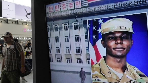 A TV screen shows a file image of American soldier Travis King during a news program at the Seoul Railway Station in Seoul, South Korea, on Wednesday.