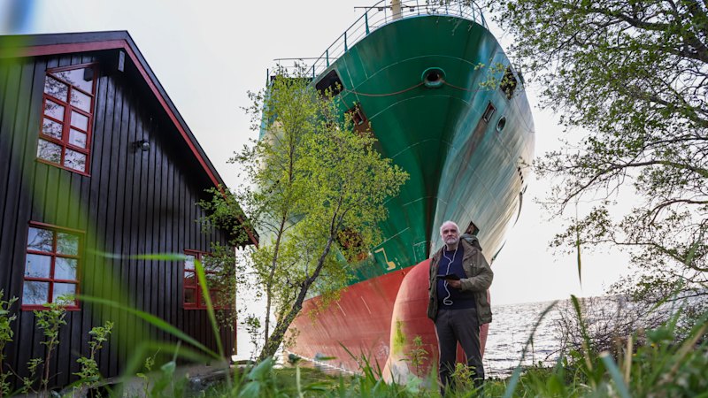 ‘It was quite absurd’: Man awakes to find container ship wedged in his yard