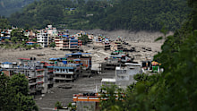 A flood-damaged section of a highway in Nuwakot, Central Nepal, following the outburst flood of a glacial lake in Tibet.