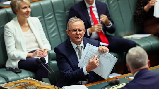Opposition Leader Anthony Albanese with the 2021 budget during Question Time in the House of Representatives at Parliament House in Canberra on May 12, 2021. fedpol Photo: Dominic Lorrimer