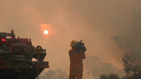 Firefighters  battle bushfires in Angourie, northern New South Wales.
