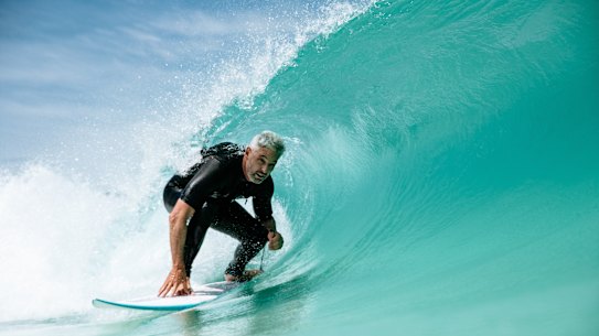 Urbnsurf founder Andrew Ross rides an artificial wave at his facility.