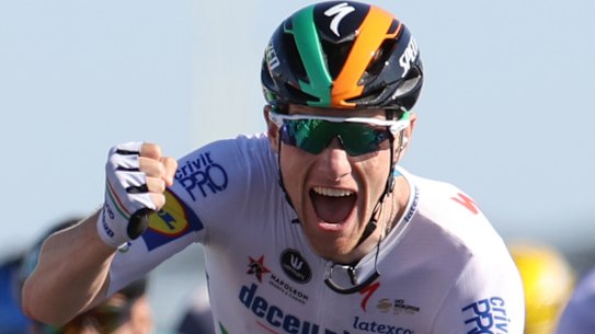 Ireland's Sam Bennett celebrates as he crosses the finish line to win stage 10 of the Tour de France.