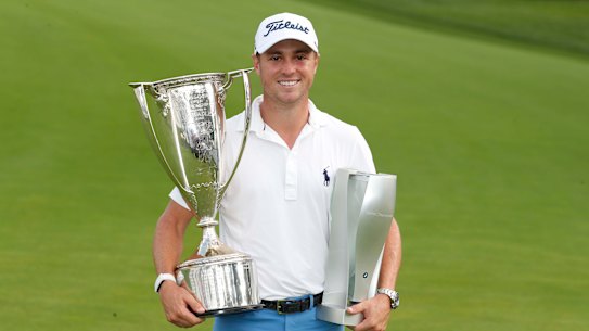 Justin Thomas with the spoils of victory from the BMW Championship.
