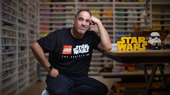 Ryan McNaught in his Tullamarine warehouse where clear boxes of carefully sorted Lego line every wall 