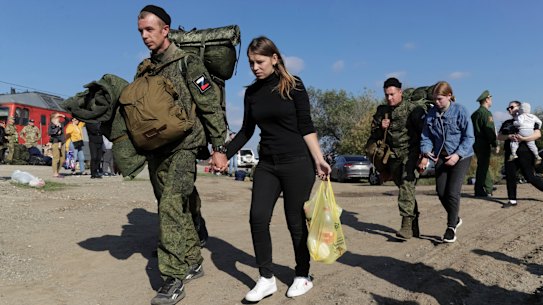 Russian recruits escorted by their wives walk to take a train at a railway station in Prudboi, Volgograd region of Russia in September. Many of those mobilised to join Russia’s war on Ukraine have minimal or no military experience.