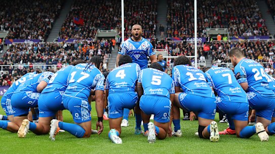 Junior Paulo leads Samoa’s Manu Siva Tau before their World Cup opener against England.
