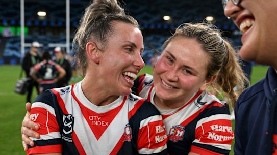 Sam Bremner (left) with teammate Keeley Davis after winning their NRLW semi-final against the Knights.