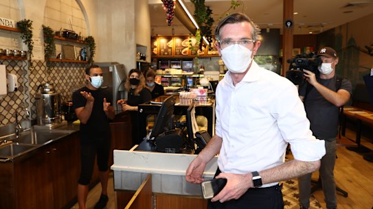 NSW Premier Dominic Perrottet visits a cafe at Casula Mall on Thursday.
