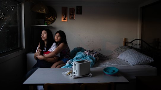 Su Myat and her daughter Mee Mee, in their shared bedroom in Blacktown. They also eat in that room.