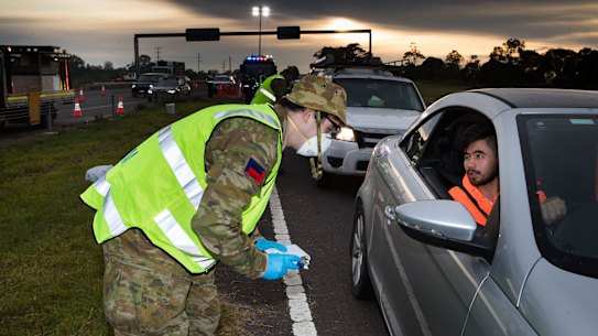 The defence forces checking drivers on the Geelong highway on June 10.