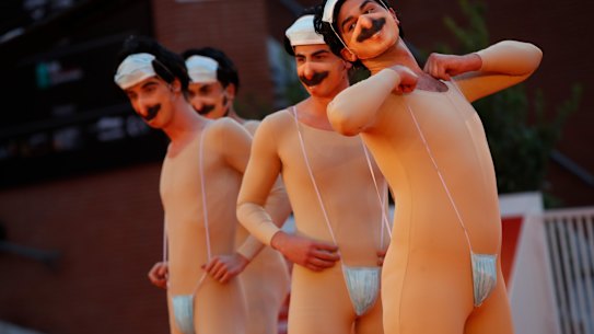Performers impersonating Borat arrive for the red carpet for the movie "Borat" at the Rome Film Festival on Friday.