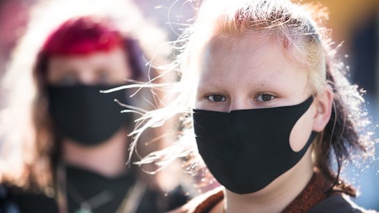 Saffron Walker and Dorien Gaston   wore masks on Brunswick Street in  Fitzroy on Wednesday.