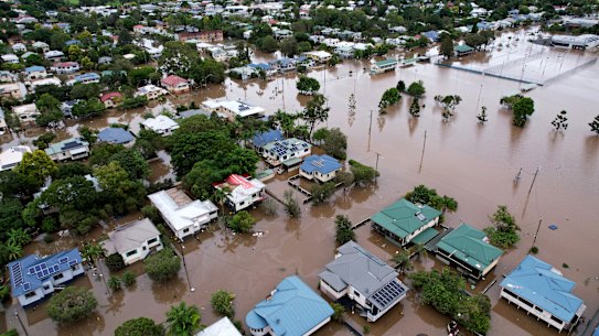 Stay or go? Lismore homes surrounded by floodwater in late March this year.