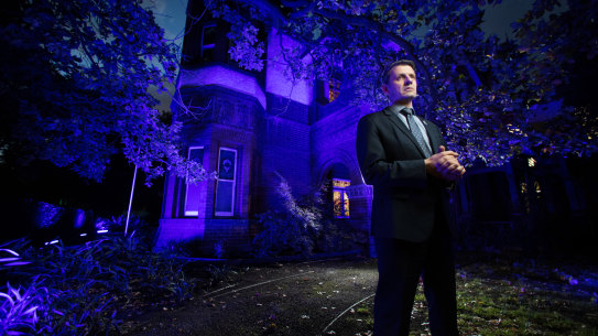 Police Association secretary Wayne Gatt  at the association’s offices which are lit up to remember the four officers who died on the Eastern Freeway a year ago.