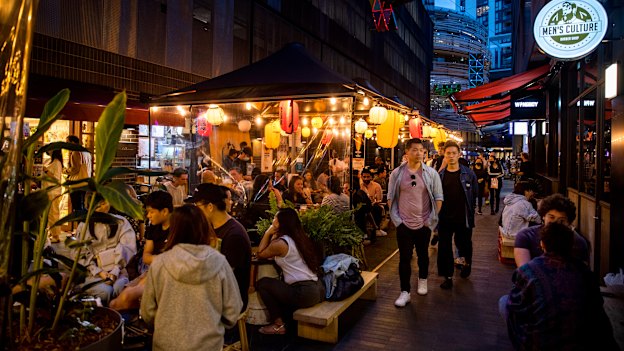 Diners outside Nakano Darling on Steam Mill Lane in the thriving Darling Square area.