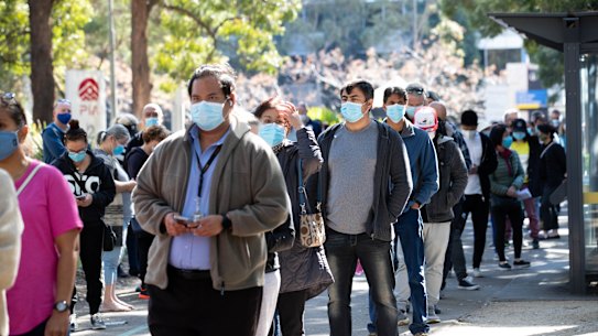 People line up to receive their COVID jab in Homebush.