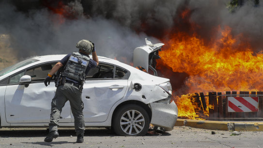 Missiles fired from Gaza set cars alight in the southern Israeli town of Ashkelon.