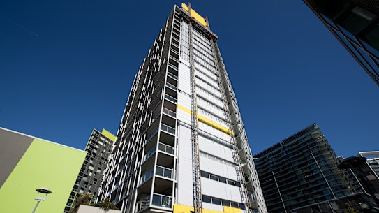 Cladding is removed from the Distillery apartment tower in Pyrmont. 