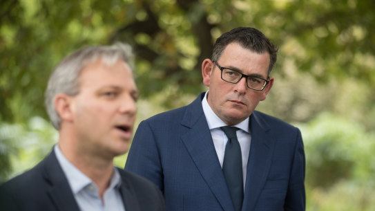 Daniel Andrews (right) with the state's chief health officer, Brett Sutton, on Wednesday.