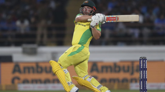 Aaron Finch goes over the top against India.
