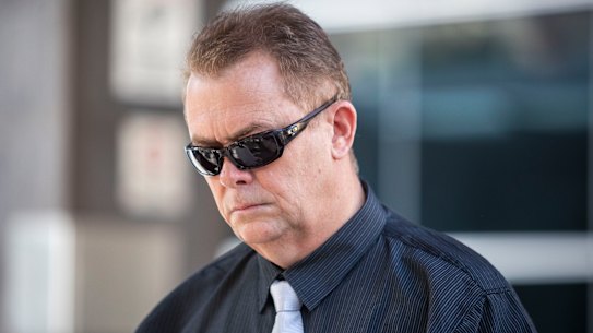 Queensland Police Senior Constable Neil Punchard leaves the Magistrates Court in Brisbane on Monday.